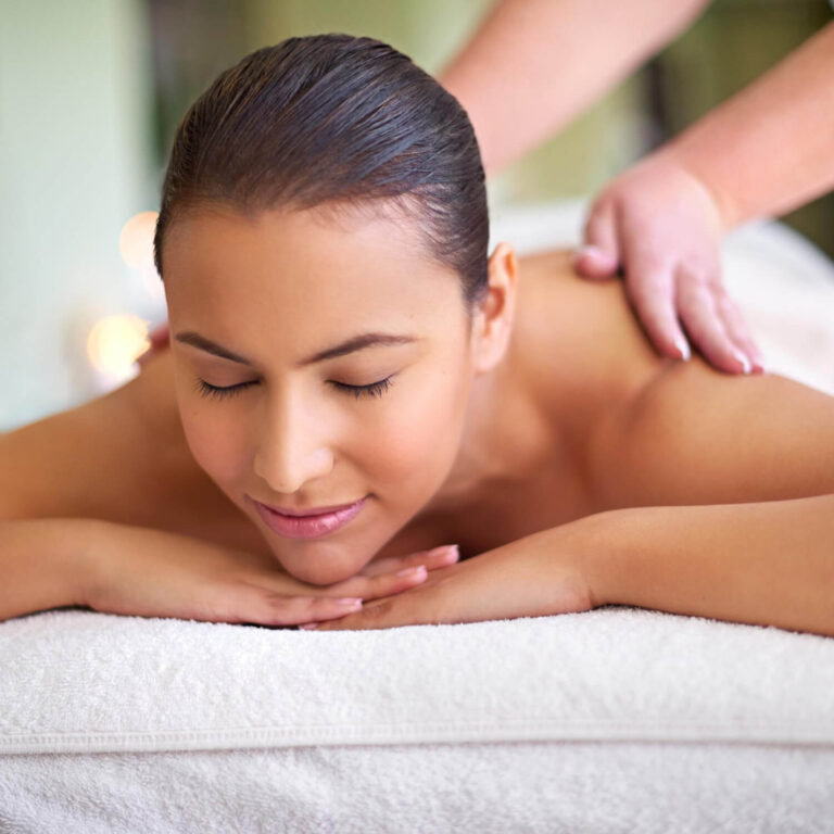 Tui Na therapy being performed, using traditional Chinese massage techniques on a patient’s back at Family Acupuncture Clinic Jacksonville.